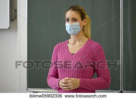 Stock Photograph - Teacher with face mask, Corona crisis, Baden-Württemberg, Germany, Europe. Fotosearch