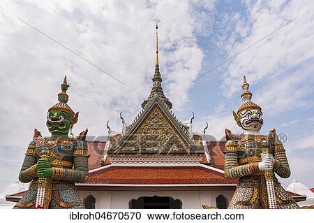 Stock Image - Temple with temple guards, Wat Arun, Temple of Dawn, Bangkok, Thailand, Asia. Fotosearch