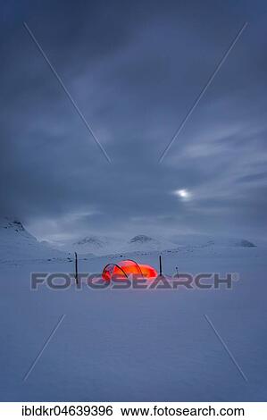 Stock Photograph - Tent by full moon in the snow, Kungsleden or king's trail, Province of Lapland, Sweden, Scandinavia, Europe. Fotosearch