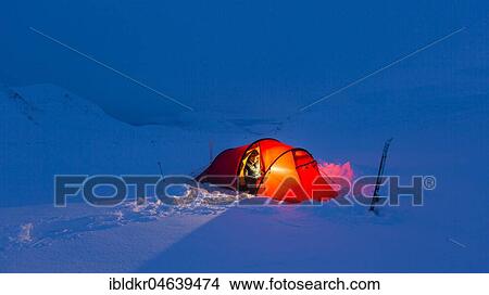 Picture - Tent with person in the snow, Kungsleden or king's trail, Province of Lapland, Sweden, Scandinavia, Europe. Fotosearch