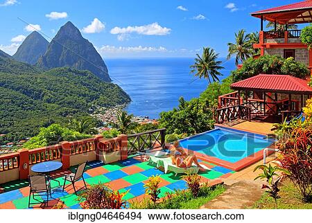 Picture - Terrace with swimming pool of the Samfi Gardens Resort with view of the village and the two pitons, Gros Piton 770m and Petit Piton 743m, Soufriere, St. Lucia, Lesser Antilles, West Indian Islands, Caribbean Sea. Fotosearch