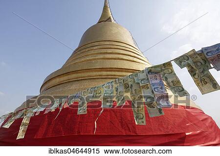 Thai banknotes are hanging on a leash in front of the golden Chedi, money donation on Phu Khao Thong, Golden Mountain in Wat Saket, district Pom Prap Sattru Phai, Bangkok, Thailand, Asia View Large Photo Image Stock Photography - Thai banknotes are hanging on a leash in front of the golden Chedi, money donation on Phu Khao Thong, Golden Mountain in Wat Saket, district Pom Prap Sattru Phai, Bangkok, Thailand, Asia. Fotosearch
