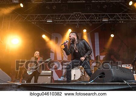 Stock Image - The American rock band Rival Sons live at the 27th Heitere Open Air in Zofingen, Aargau, Switzerland Jay Buchanan, vocals Scott Holiday, guitar Dave Beste, bass. Fotosearch