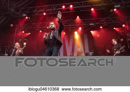 Stock Photo - The American rock band Rival Sons live at the 27th Heitere Open Air in Zofingen, Aargau, Switzerland Jay Buchanan, vocals Scott Holiday, guitar Dave Beste, bass. Fotosearch
