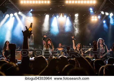 The American women's metal band The Iron Maidens, tribute band of the British heavy metal band Iron Maiden live in the Schüür Lucerne, Switzerland vocals Kirsten Rosenberg drumset Linda McDonald guitar Courtney Cox guitar Nita Strauss View Large Photo Image Picture - The American women's metal band The Iron Maidens, tribute band of the British heavy metal band Iron Maiden live in the Schüür Lucerne, Switzerland vocals Kirsten Rosenberg drumset Linda McDonald guitar Courtney Cox guitar Nita Strauss. Fotosearch