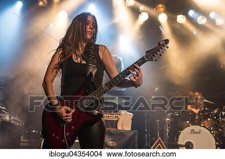The American women's metal band The Iron Maidens, tribute band of the British heavy metal band Iron Maiden live in the Schüür Lucerne, Switzerland vocals Kirsten Rosenberg drumset Linda McDonald guitar Courtney Cox guitar Nita Strauss View Large Photo Image Picture - The American women's metal band The Iron Maidens, tribute band of the British heavy metal band Iron Maiden live in the Schüür Lucerne, Switzerland vocals Kirsten Rosenberg drumset Linda McDonald guitar Courtney Cox guitar Nita Strauss. Fotosearch