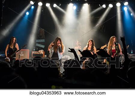 The American women's metal band The Iron Maidens, tribute band of the British heavy metal band Iron Maiden live in the Schüür Lucerne, Switzerland vocals Kirsten Rosenberg drumset Linda McDonald guitar Courtney Cox guitar Nita Strauss View Large Photo Image Stock Image - The American women's metal band The Iron Maidens, tribute band of the British heavy metal band Iron Maiden live in the Schüür Lucerne, Switzerland vocals Kirsten Rosenberg drumset Linda McDonald guitar Courtney Cox guitar Nita Strauss. Fotosearch