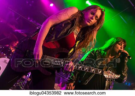 The American women's metal band The Iron Maidens, tribute band of the British heavy metal band Iron Maiden live in the Schüür Lucerne, Switzerland vocals Kirsten Rosenberg drumset Linda McDonald guitar Courtney Cox guitar Nita Strauss View Large Photo Image Stock Image - The American women's metal band The Iron Maidens, tribute band of the British heavy metal band Iron Maiden live in the Schüür Lucerne, Switzerland vocals Kirsten Rosenberg drumset Linda McDonald guitar Courtney Cox guitar Nita Strauss. Fotosearch