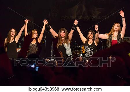 The American women's metal band The Iron Maidens, tribute band of the British heavy metal band Iron Maiden live in the Schüür Lucerne, Switzerland vocals Kirsten Rosenberg drumset Linda McDonald guitar Courtney Cox guitar Nita Strauss View Large Photo Image Stock Photo - The American women's metal band The Iron Maidens, tribute band of the British heavy metal band Iron Maiden live in the Schüür Lucerne, Switzerland vocals Kirsten Rosenberg drumset Linda McDonald guitar Courtney Cox guitar Nita Strauss. Fotosearch