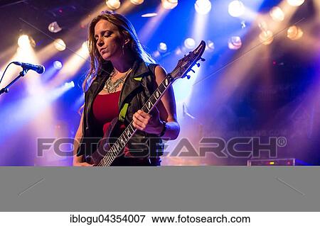 The American women's metal band The Iron Maidens, tribute band of the British heavy metal band Iron Maiden live in the Schüür Lucerne, Switzerland vocals Kirsten Rosenberg drumset Linda McDonald guitar Courtney Cox guitar Nita Strauss View Large Photo Image Stock Photo - The American women's metal band The Iron Maidens, tribute band of the British heavy metal band Iron Maiden live in the Schüür Lucerne, Switzerland vocals Kirsten Rosenberg drumset Linda McDonald guitar Courtney Cox guitar Nita Strauss. Fotosearch