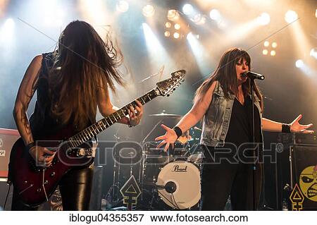 The American women's metal band The Iron Maidens, tribute band of the British heavy metal band Iron Maiden live in the Schüür Lucerne, Switzerland vocals Kirsten Rosenberg drumset Linda McDonald guitar Courtney Cox guitar Nita Strauss View Large Photo Image Stock Photo - The American women's metal band The Iron Maidens, tribute band of the British heavy metal band Iron Maiden live in the Schüür Lucerne, Switzerland vocals Kirsten Rosenberg drumset Linda McDonald guitar Courtney Cox guitar Nita Strauss. Fotosearch