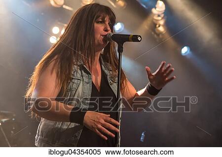 The American women's metal band The Iron Maidens, tribute band of the British heavy metal band Iron Maiden live in the Schüür Lucerne, Switzerland vocals Kirsten Rosenberg drumset Linda McDonald guitar Courtney Cox guitar Nita Strauss View Large Photo Image Stock Photography - The American women's metal band The Iron Maidens, tribute band of the British heavy metal band Iron Maiden live in the Schüür Lucerne, Switzerland vocals Kirsten Rosenberg drumset Linda McDonald guitar Courtney Cox guitar Nita Strauss. Fotosearch
