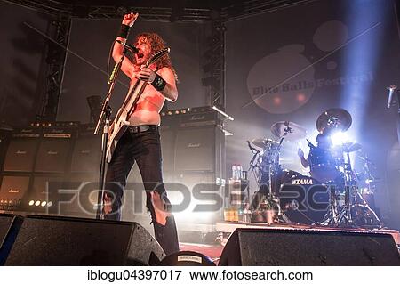 Stock Photo - The Australian hard rock band Airbourne live at the Blue Balls Festival Lucerne, Switzerland Joel O' Keeffe, vocals and guitar David Roads, guitar Justin Street, bass Ryan O' Keeffe, drums. Fotosearch