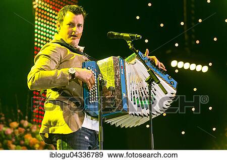 The Austrian pop singer and accordion player Marc Pircher live at the 16th Schlager Nacht in Lucerne, Switzerland, Europe View Large Photo Image Stock Photo - The Austrian pop singer and accordion player Marc Pircher live at the 16th Schlager Nacht in Lucerne, Switzerland, Europe. Fotosearch