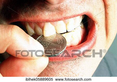 The good old German Mark, DM, hard currency, man bites into a coin, Berlin, Germany, Europe View Large Photo Image Stock Photography - The good old German Mark, DM, hard currency, man bites into a coin, Berlin, Germany, Europe. Fotosearch