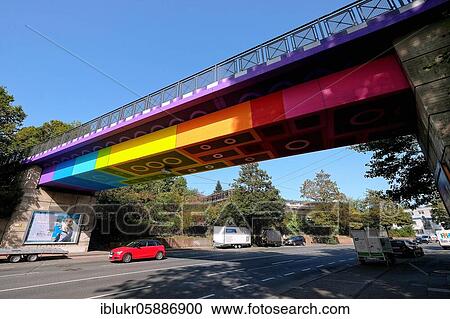 The Lego Bridge 2. 0 or Rainbow Bridge is a concrete beam bridge over Dahler Straße in Wuppertal-Langerfeld. Developed by graffiti and streetart artist Martin Heuwold, stage name MEGX, in Lego brick design View Large Photo Image Stock Image - The Lego Bridge 2. 0 or Rainbow Bridge is a concrete beam bridge over Dahler Straße in Wuppertal-Langerfeld. Developed by graffiti and streetart artist Martin Heuwold, stage name MEGX, in Lego brick design. Fotosearch