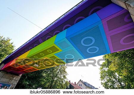 The Lego Bridge 2. 0 or Rainbow Bridge is a concrete beam bridge over Dahler Straße in Wuppertal-Langerfeld. Developed by graffiti and streetart artist Martin Heuwold, stage name MEGX, in Lego brick design View Large Photo Image Stock Photograph - The Lego Bridge 2. 0 or Rainbow Bridge is a concrete beam bridge over Dahler Straße in Wuppertal-Langerfeld. Developed by graffiti and streetart artist Martin Heuwold, stage name MEGX, in Lego brick design. Fotosearch