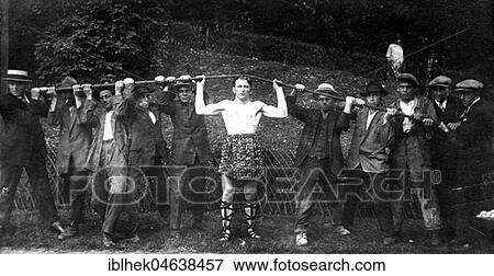Stock Photo - The strongest man in the world bends an iron rod, 1910, exact location unknown, Germany, Europe. Fotosearch