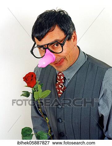 The suitor, parody, man with condom on his nose and red rose, Berlin, Germany, Europe View Large Photo Image Stock Photo - The suitor, parody, man with condom on his nose and red rose, Berlin, Germany, Europe. Fotosearch