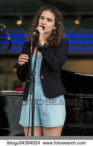 The Swiss dialect singer Milena live at the Blue Balls Festival Lucerne, Switzerland Milena Dürst: Vocals, Compositions Mischa Maurer: Piano Valentin v. Fischer: Double Bass View Large Photo Image Picture - The Swiss dialect singer Milena live at the Blue Balls Festival Lucerne, Switzerland Milena Dürst: Vocals, Compositions Mischa Maurer: Piano Valentin v. Fischer: Double Bass. Fotosearch
