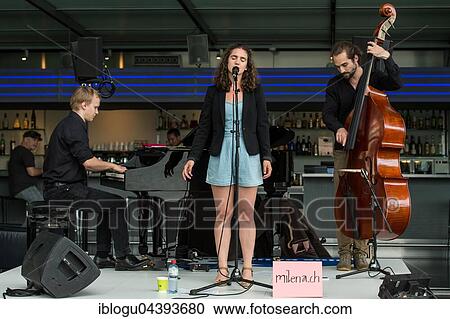 The Swiss dialect singer Milena live at the Blue Balls Festival Lucerne, Switzerland Milena Dürst: Vocals, Compositions Mischa Maurer: Piano Valentin v. Fischer: Double Bass View Large Photo Image Stock Image - The Swiss dialect singer Milena live at the Blue Balls Festival Lucerne, Switzerland Milena Dürst: Vocals, Compositions Mischa Maurer: Piano Valentin v. Fischer: Double Bass. Fotosearch