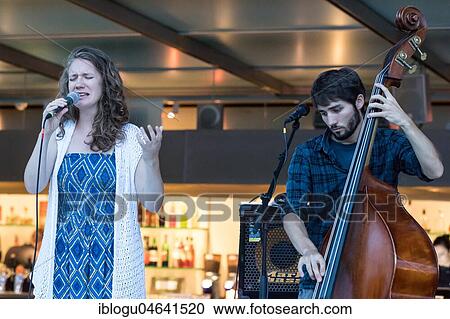 The Swiss musician duo Avender with singer Despina Corazza and the double bass Jonas Künzli live at the 25th Blue Balls Festival in Lucerne, Switzerland, Europe View Large Photo Image Stock Image - The Swiss musician duo Avender with singer Despina Corazza and the double bass Jonas Künzli live at the 25th Blue Balls Festival in Lucerne, Switzerland, Europe. Fotosearch
