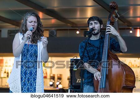 The Swiss musician duo Avender with singer Despina Corazza and the double bass Jonas Künzli live at the 25th Blue Balls Festival in Lucerne, Switzerland, Europe View Large Photo Image Stock Photo - The Swiss musician duo Avender with singer Despina Corazza and the double bass Jonas Künzli live at the 25th Blue Balls Festival in Lucerne, Switzerland, Europe. Fotosearch