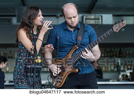 The Swiss musician duo Belle and Bass with singer Kira Stahel and bassist Stefan Guggisberg live at the 25th Blue Balls Festival in Lucerne, Switzerland, Europe View Large Photo Image Stock Photo - The Swiss musician duo Belle and Bass with singer Kira Stahel and bassist Stefan Guggisberg live at the 25th Blue Balls Festival in Lucerne, Switzerland, Europe. Fotosearch