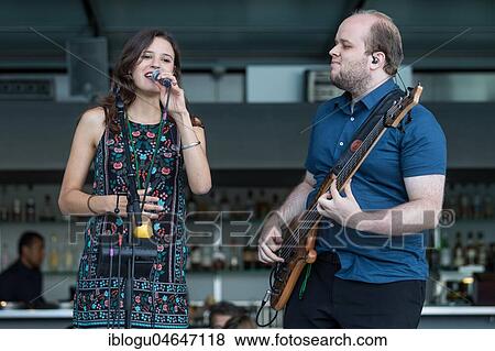 The Swiss musician duo Belle and Bass with singer Kira Stahel and bassist Stefan Guggisberg live at the 25th Blue Balls Festival in Lucerne, Switzerland, Europe View Large Photo Image Stock Photo - The Swiss musician duo Belle and Bass with singer Kira Stahel and bassist Stefan Guggisberg live at the 25th Blue Balls Festival in Lucerne, Switzerland, Europe. Fotosearch