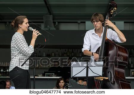 The Swiss musician duo Duo Centrepiece with Adeline Hasler, vocals and Jonas Hoenig, bass live at the 25th Blue Balls Festival in Lucerne, Switzerland, Europe View Large Photo Image Picture - The Swiss musician duo Duo Centrepiece with Adeline Hasler, vocals and Jonas Hoenig, bass live at the 25th Blue Balls Festival in Lucerne, Switzerland, Europe. Fotosearch