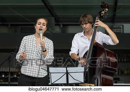 Stock Image - The Swiss musician duo Duo Centrepiece with Adeline Hasler, vocals and Jonas Hoenig, bass live at the 25th Blue Balls Festival in Lucerne, Switzerland, Europe. Fotosearch