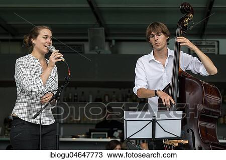 The Swiss musician duo Duo Centrepiece with Adeline Hasler, vocals and Jonas Hoenig, bass live at the 25th Blue Balls Festival in Lucerne, Switzerland, Europe View Large Photo Image Stock Image - The Swiss musician duo Duo Centrepiece with Adeline Hasler, vocals and Jonas Hoenig, bass live at the 25th Blue Balls Festival in Lucerne, Switzerland, Europe. Fotosearch