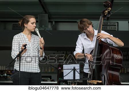 The Swiss musician duo Duo Centrepiece with Adeline Hasler, vocals and Jonas Hoenig, bass live at the 25th Blue Balls Festival in Lucerne, Switzerland, Europe View Large Photo Image Stock Photo - The Swiss musician duo Duo Centrepiece with Adeline Hasler, vocals and Jonas Hoenig, bass live at the 25th Blue Balls Festival in Lucerne, Switzerland, Europe. Fotosearch
