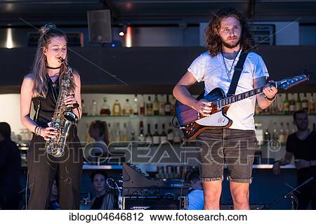The Swiss musician duo Sarda with Sarah Belz, saxophone and David Friedli, guitar live at the 25th Blue Balls Festival in Lucerne, Switzerland, Europe View Large Photo Image Stock Image - The Swiss musician duo Sarda with Sarah Belz, saxophone and David Friedli, guitar live at the 25th Blue Balls Festival in Lucerne, Switzerland, Europe. Fotosearch