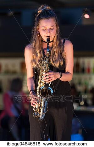 The Swiss musician duo Sarda with Sarah Belz, saxophone and David Friedli, guitar live at the 25th Blue Balls Festival in Lucerne, Switzerland, Europe View Large Photo Image Stock Photography - The Swiss musician duo Sarda with Sarah Belz, saxophone and David Friedli, guitar live at the 25th Blue Balls Festival in Lucerne, Switzerland, Europe. Fotosearch