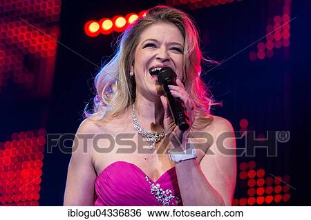 Stock Photograph - The Swiss Schlager and folk music singer Monique live at the 16th Schlager Nacht in Lucerne, Switzerland, Europe. Fotosearch