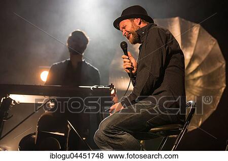 Stock Photo - The Swiss singer and songwriter Lukas Linder alias Henrik Belden with band at the record baptism live in the Schüür Lucerne, Switzerland, Europe. Fotosearch