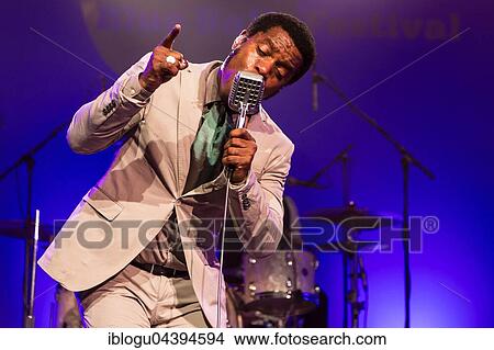 The US-American Rhythm and Blues Band Vintage Trouble live at the Blue Balls Festival Lucerne, Switzerland Ty Taylor: Vocals Nalle Colt: Guitar Rick Barrio Dill: Bass Richard Danielson: Drums View Large Photo Image Picture - The US-American Rhythm and Blues Band Vintage Trouble live at the Blue Balls Festival Lucerne, Switzerland Ty Taylor: Vocals Nalle Colt: Guitar Rick Barrio Dill: Bass Richard Danielson: Drums. Fotosearch