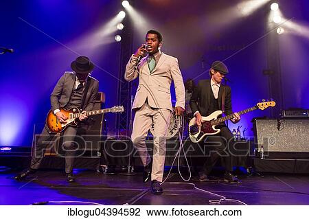 The US-American Rhythm and Blues Band Vintage Trouble live at the Blue Balls Festival Lucerne, Switzerland Ty Taylor: Vocals Nalle Colt: Guitar Rick Barrio Dill: Bass Richard Danielson: Drums View Large Photo Image Stock Image - The US-American Rhythm and Blues Band Vintage Trouble live at the Blue Balls Festival Lucerne, Switzerland Ty Taylor: Vocals Nalle Colt: Guitar Rick Barrio Dill: Bass Richard Danielson: Drums. Fotosearch