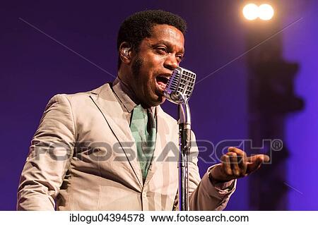 The US-American Rhythm and Blues Band Vintage Trouble live at the Blue Balls Festival Lucerne, Switzerland Ty Taylor: Vocals Nalle Colt: Guitar Rick Barrio Dill: Bass Richard Danielson: Drums View Large Photo Image Stock Photo - The US-American Rhythm and Blues Band Vintage Trouble live at the Blue Balls Festival Lucerne, Switzerland Ty Taylor: Vocals Nalle Colt: Guitar Rick Barrio Dill: Bass Richard Danielson: Drums. Fotosearch