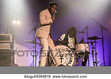 Stock Photo - The US-American Rhythm and Blues Band Vintage Trouble live at the Blue Balls Festival Lucerne, Switzerland Ty Taylor: Vocals Nalle Colt: Guitar Rick Barrio Dill: Bass Richard Danielson: Drums. Fotosearch