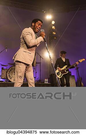 The US-American Rhythm and Blues Band Vintage Trouble live at the Blue Balls Festival Lucerne, Switzerland Ty Taylor: Vocals Nalle Colt: Guitar Rick Barrio Dill: Bass Richard Danielson: Drums View Large Photo Image Stock Photography - The US-American Rhythm and Blues Band Vintage Trouble live at the Blue Balls Festival Lucerne, Switzerland Ty Taylor: Vocals Nalle Colt: Guitar Rick Barrio Dill: Bass Richard Danielson: Drums. Fotosearch