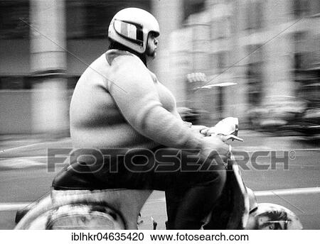 Thick man on a scooter, between 50s and 60s, exact place unknown, France, Europe View Large Photo Image Stock Image - Thick man on a scooter, between 50s and 60s, exact place unknown, France, Europe. Fotosearch