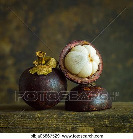 Stock Photo - Three mangosteens, studio shot, France, Europe. Fotosearch