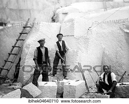 Stock Image - Three men working in the quarry, 1920s, exact location unknown, Germany, Europe. Fotosearch