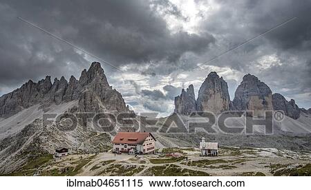 Stock Photography - Three Peaks Cottage with Patternkofel and north walls of the Three Peaks, Sexten Dolomites, South Tyrol, Trentino-South Tyrol, Alto-Adige, Italy, Europe. Fotosearch