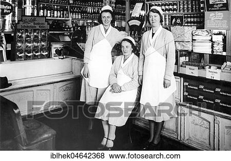 Stock Photo - Three saleswomen in the grocery store, 1950s, Germany, Europe. Fotosearch