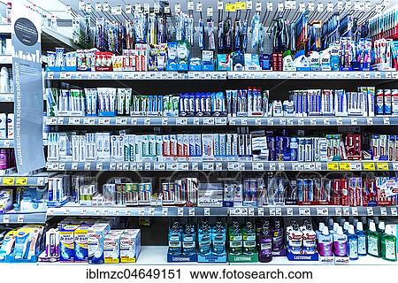 Toothpaste and toothbrushes in a supermarket shelf, Germany, Europe View Large Photo Image Stock Image - Toothpaste and toothbrushes in a supermarket shelf, Germany, Europe. Fotosearch
