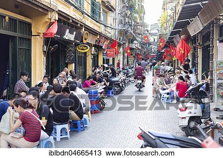 Stock Image - Tourists, Hoan Kiem old quarter, Hanoi, Vietnam, Asia. Fotosearch