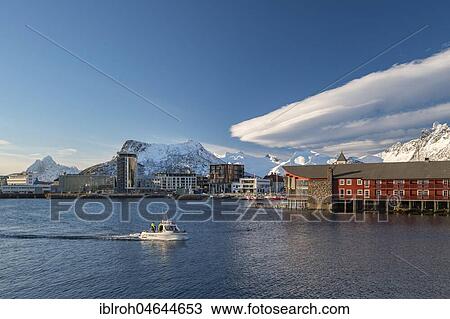 Stock Image - Townscape Svolvaer, harbour, snow-covered mountains in the background, Austvågøy, Lofoten, Norway, Europe. Fotosearch